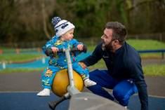 A person and a baby on a scooter

AI-generated content may be incorrect.